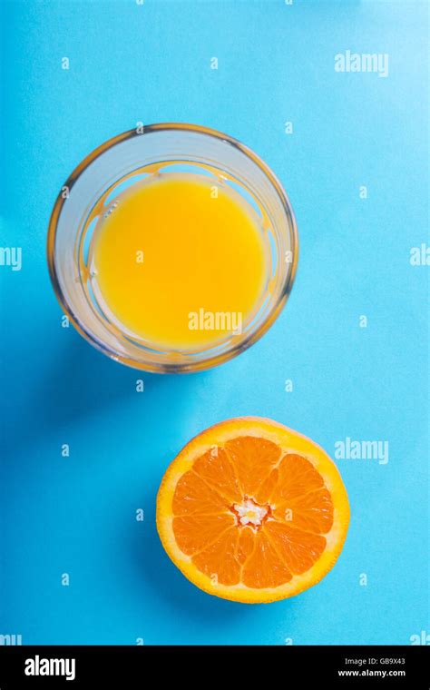 Glass Of Orange Juice And Half Of Orange Stock Photo Alamy