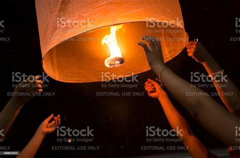 People Releasing A Lantern Stock Photo Download Image Now Balloon