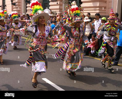 People In Traditional Peruvian Dress Dancing In The Street In Lima