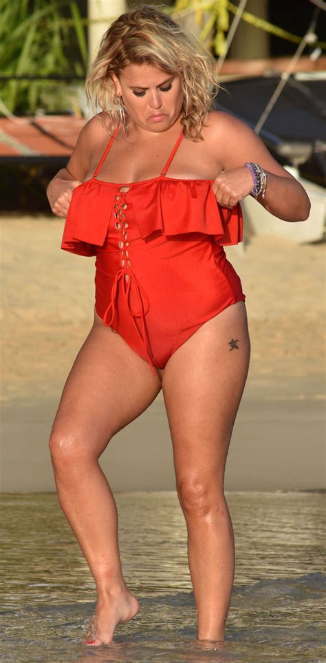 Nadia Essex In A Red Swimsuit Enjoying The Sun Sand And Sea In Barbados