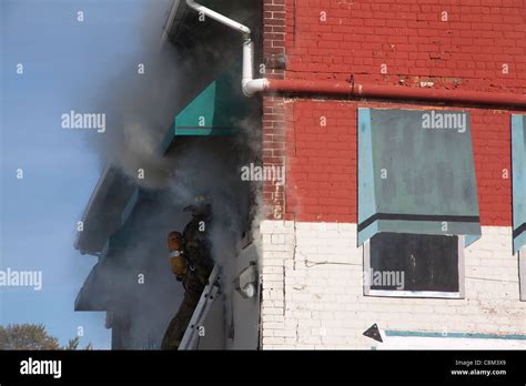 Firefighters Entering Second Floor Of Burning Commercial Building Fire