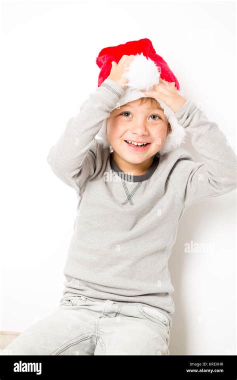 Happy Christmas Boy In Santa Hat On White Background Stock Photo Alamy