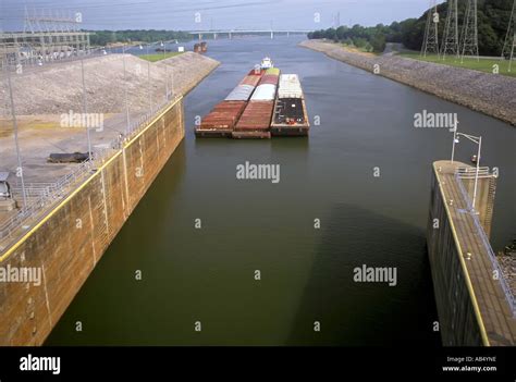 Tug Boats Pushes Barges Through A Water Lock System On The Ohio River Near Louisville Kentucky