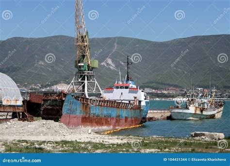 Old Ship With A Cargo Crane On The Dock Stock Photo Image Of