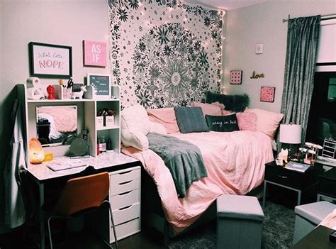 A Bedroom With Pink And Black Decor On The Walls Desks And Bed