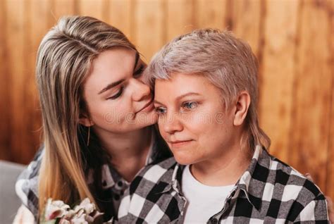 Beautiful Young Woman Hugs Her Mother Close Up Portrait Stock Photo