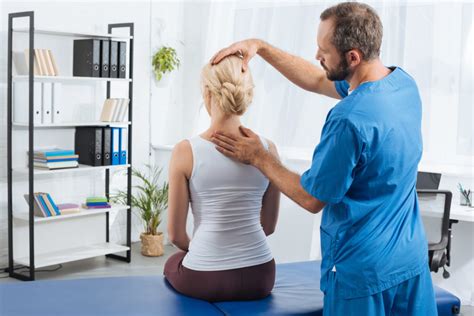 Physiotherapist Doing Massage To Woman On Massage Table In Hospital Dol Doctors Indiana