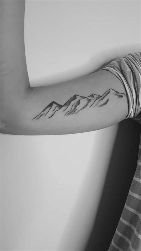 Showcase Your Adventurous Spirit With A Mountain Range Tattoo