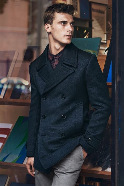 Try Teaming A Navy Pea Coat With Grey Chino Pants For A Dapper Casual