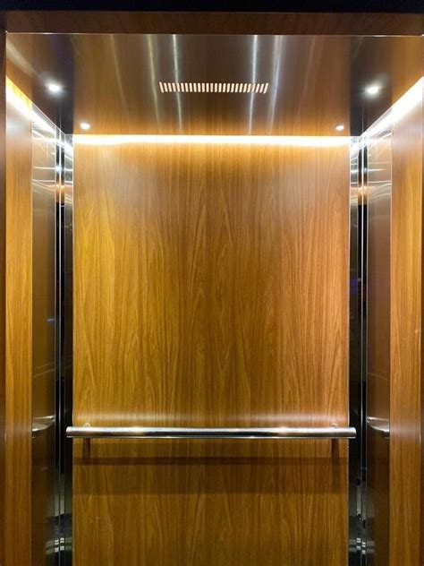 Seiko Elevators Stainless Steel Wood Finish Center Opening Elevator