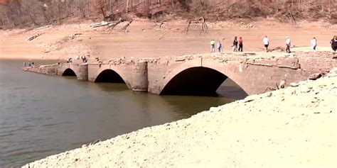 Historic bridge, remnants of town buried by water revealed