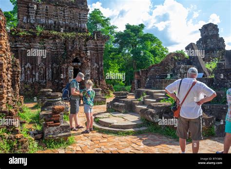 tourists exploring ancient town ruins in My Son, Vietnam Stock Photo ...