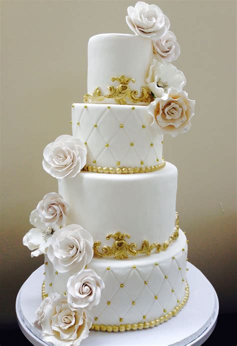 All White Wedding Cake With Gold Accents White And Gold Wedding Cake Wedding Cake Photos