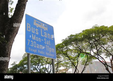 Bus lane sign Singapore Stock Photo - Alamy