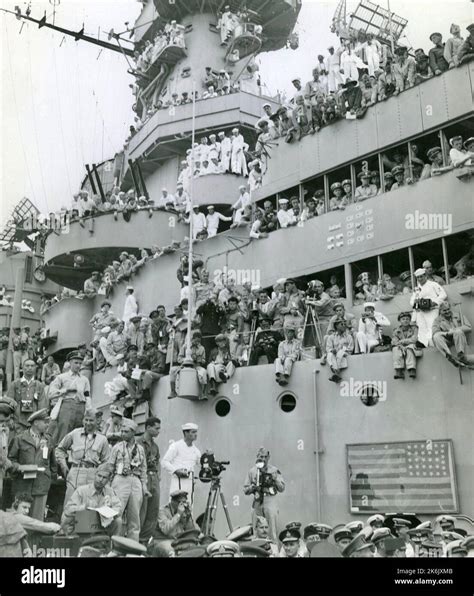 Spectators And Photographer Pick Vantage Spots On The Deck Of The USS