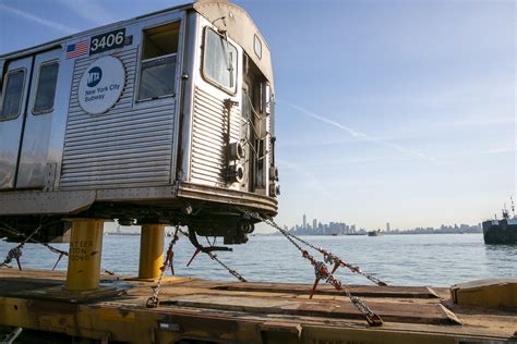 Bon voyage: Old subway cars float off across New York Harbor | AP News