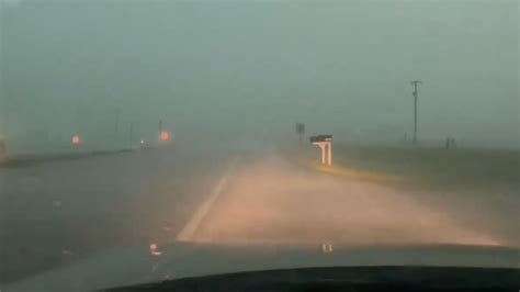 Large Rain Wrapped Tornado Crossing Highway | WeatherBug