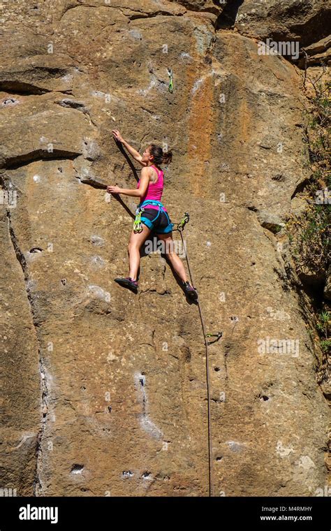 Slim young female rock climbing at Arico, Tenerife Stock Photo - Alamy