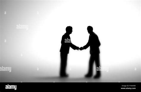 Business People Silhouette Shaking Hands