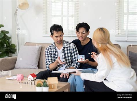 LGBT And Financial Planning A Gay Couple Discussing Savings And