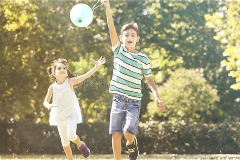 Children Having Fun Outdoors Concept Stock Photo - Image of laughing ...