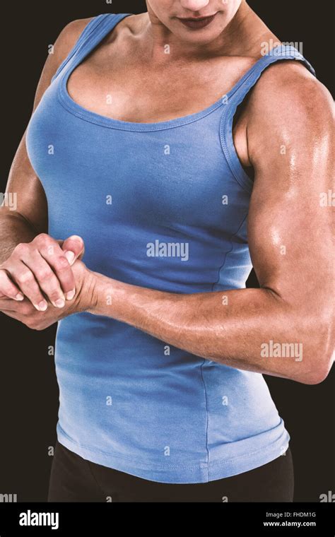 Composite Image Of Muscular Woman Flexing Her Muscle Stock Photo Alamy