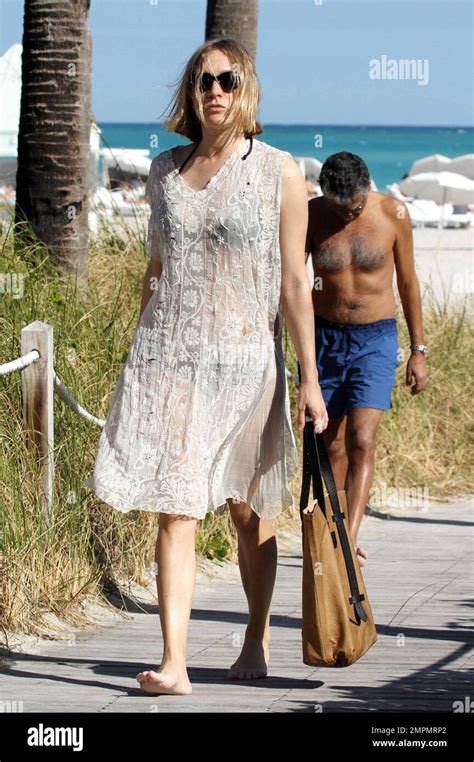 Chloe Sevigny Covers Up Her Black Bikini With A White Lace Dress While Enjoying The South