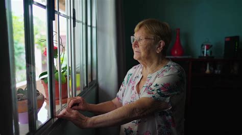 Contemplative Elderly Woman Standing Window Stock Footage Sbv 348475918 Storyblocks