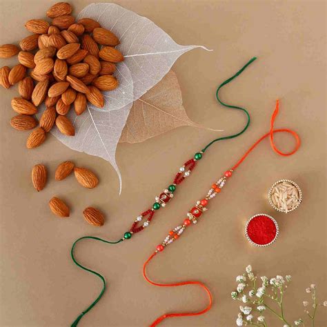 Sneh Green Pearl Rakhi Set With Almonds