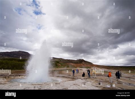 Tourists Watching Strokkur Geyser Erupting Geysir Iceland Stock Photo