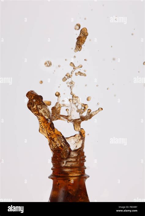 soda splash out from bottle Stock Photo - Alamy