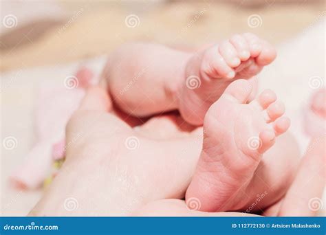 The Legs Of A Newborn Close Up Stock Photo Image Of Innocent Feet