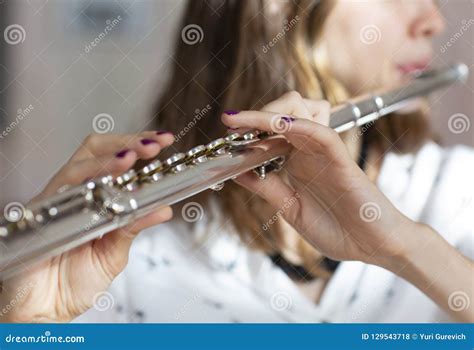 Girl Plays On Flute Flute In Hands Of Girl During The Concert