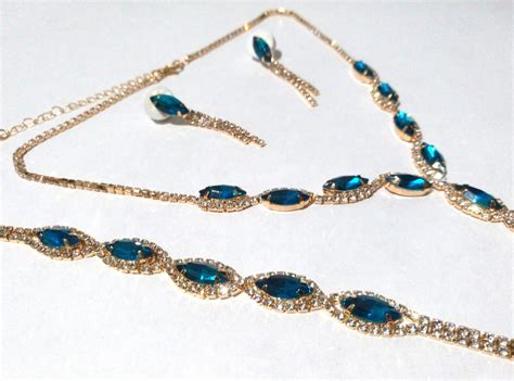 Conjunto Colar Brincos Pulseira Dourado Cristal Azul Royal Elo