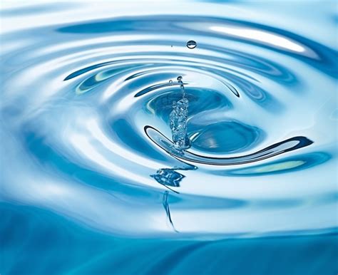 Water Droplet Is Shown In A Clear Blue Water Background Clean Simple