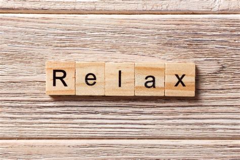 Relax Word Written On Wood Block Relax Text On Table Concept Stock