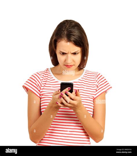 Confused Or Bewilderment Upset Woman Looking At Her Mobile Phone Emotional Girl Isolated On