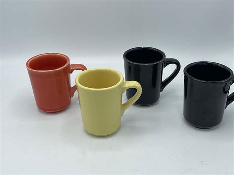 Lot - 4 Assorted Fiesta ware mugs