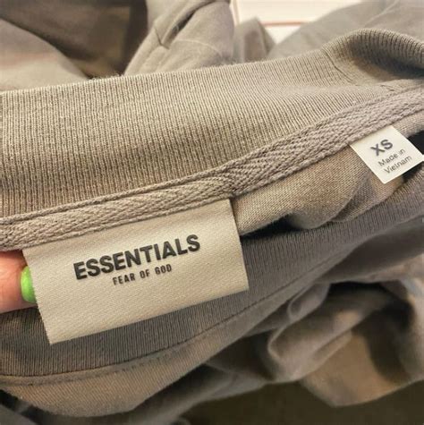 july  convincing fake essentials sweatshirt logo tag  kosher