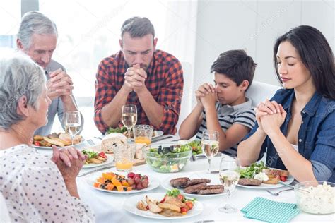 Family praying together before meal ⬇ Stock Photo, Image by ...