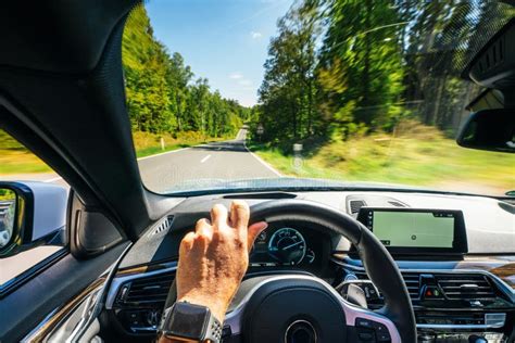 Hands Of Car Driver On Steering Wheel Road Trip Driving On Highway