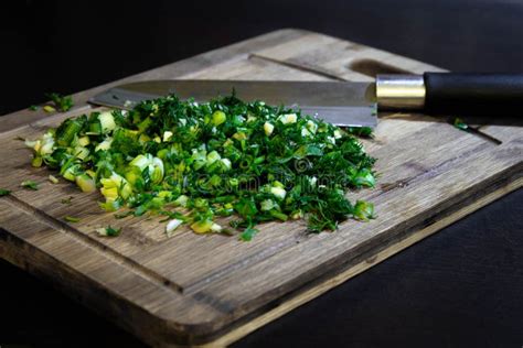 Cutting Bunch Of Fresh Dill On Wooden Cutting Board Stock Photo Image