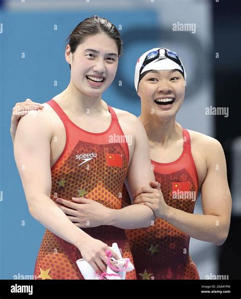 Tokyo, Japan. 29th July, 2021. Zhang Yufei (L) of China reacts with ...