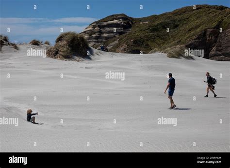 Tourists At Wharariki Beach New Zealand South Island S Most Northerly