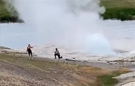 Moron Tourists At Yellowstone Get Right Up Next To Geyser For A Picture