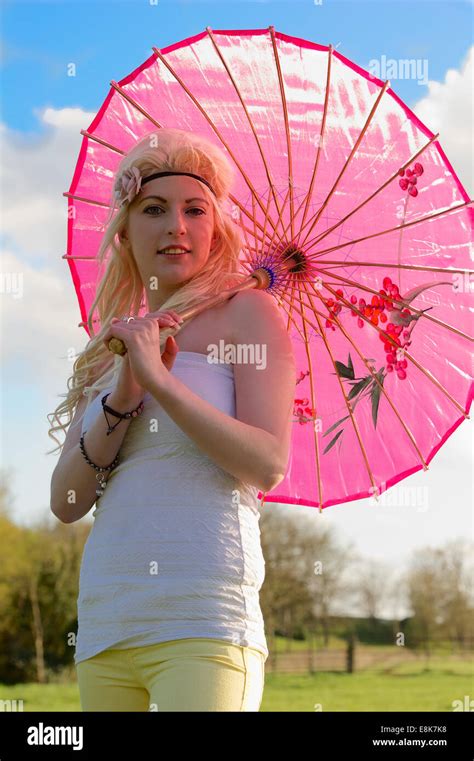 Beautiful Blond Girl Holding A Parasol Outdoor Location Stock Photo