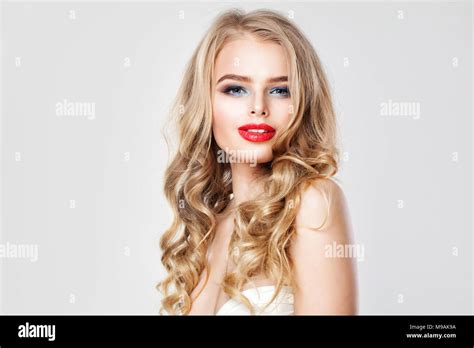 Nice Young Woman With Makeup And Blonde Wavy Hair Portrait Of Cute