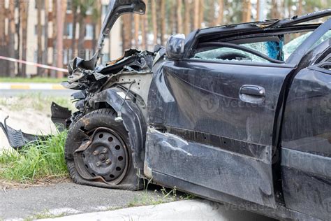 Black Car After A Terrible Accident On The Side Of The Road Frontal