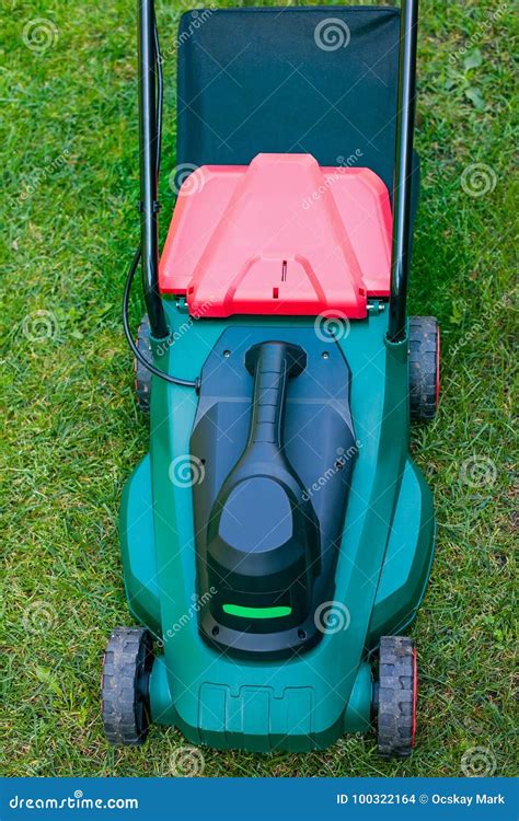 Lawn mower in the backyard stock photo. Image of ground - 100322164