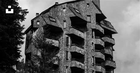 A Very Tall Building Sitting On The Side Of A Hill Photo Free Avoriaz